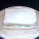 Top slice of bread is laid in place