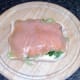 Smoked salmon slices are laid on bread