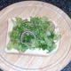 Seasoned salad bed on bread