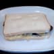 Second slice of bread completes assembly of steak and crisp sandwich