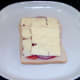 Cheese arranged on tomato and onion