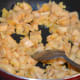Step two: Heat 1 tsp ghee in a deep-bottomed pan. Add chopped plantain. Stir-cook over low heat.
