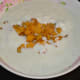 Step five: Transfer the paste to a bowl. Add remaining yogurt and sauteed plantains. Mix well. This is the raita.