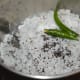 Step three: Put grated coconut, mustard seeds, salt, and green chilies in a mixer or blender.