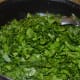 Step five: Throw in chopped spinach. Stir-cook on a high heat till they become soft.