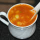Pour the soup to a deep cup. Garnish with a few chopped coriander leaves. Enjoy drinking this yummy soup!