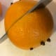 Cutting the oranges and lemons in half lets the citrus juice escape into the cider as the wassail simmers. The cloves really perfume the whole drink.