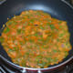 Step four: Add a few drops of oil on the surface. Cover the pan with a lid.