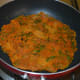 Step five: Flip it when the bottom side of the pancake becomes golden brown. Add a few drops of oil on the top side. There's no need to cover the pan.