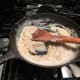 Add cream and spices to create a Béchamel sauce.