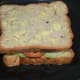 Step six: Heat a griddle or pan. Grease it with butter. Place the sandwich on it. Keep the heat medium. Roast both sides of the bread till they get golden brown, applying some butter.
