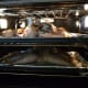 Thanks to their flattened profile, you can cook two spatchcocked turkeys at once in one standard single oven. The largest recommended size to spatchcock is around 14 pounds, so cooking two works well when you need to feed a larger crowd.