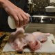 Generously salt all over both sides of the bird, and the wings.