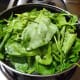 Step three: Stir-cook the remaining spinach in the same pan.