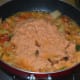 Step five: Add ground masala mix. Stir the mix till it becomes dry. You will now get a nice aroma from the roasted spices and cashew nuts.