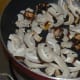 Step one: Saute thinly sliced copra (dry coconut) and tamarind till they become crispy. Transfer them to a plate.