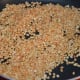 Step two: Roast white lentil also till golden brown. Add it to the roasted chickpea split.