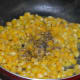 Step six: Add salt and pepper powder. Mix well. Turn off the heat.