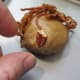 place first pecan piece on the face below the date hair