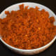 Step six: Now, your favorite garlic chutney powder is ready! Transfer it to a bowl. Store it in an air-tight container after some time. Enjoy using it as a condiment or side dish!