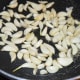 Step one: Saute garlic cloves in very little oil until they become slightly golden. Collect them in a bowl.