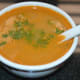 Now, your kohlrabi soup is ready. Pour it equally into 4 bowls. Garnish with a few chopped fresh green coriander leaves.