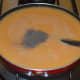 Step seven: Add some water. Strain the mix to get rid off the fiber contents. Boil the puree, adding sufficient water to keep it thin. Throw in pepper powder.