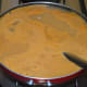 Step eight: Bring to a nice boil. Add chopped coriander leaves.