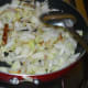 Step three: Add chopped kohlrabi. Saute till it becomes dry. Then add some water and cook, covered, for about 8 minutes.