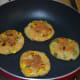 Step seven: Add a few drops of oil or butter on the top and on the edges. Roast the other side also till golden brown. Remove them on a serving plate.