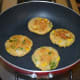 Step six: Cook them till the bottom side gets golden brown. Flip them.
