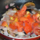 Step four: Add tomatoes. Stir-cook till they loose their raw smell. Add the contents to the same mixer/blender.