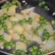 Veggies cooking in the pan.