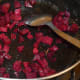 Step five: In the same pan, add 1/2 a teaspoon of butter. Throw in beetroot. Add salt to taste. Saute beetroot cubes sprinkling water little by little until they become soft.