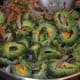Continuing to saute the veggies.