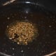 Step three: Heat oil in a pan. Saute mustard seeds and cumin seeds. Let them crackle.