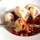 Enjoying venison sausage rolls in hot and spicy bean salad