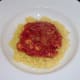 Spicy tomato and mushroom sauce on turmeric rice