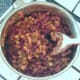beans are stirred in to reheated tomato sauce