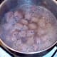 Beef stock is added to browned steak and brought to a simmer
