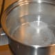 Step three: Add two tea spoons of sugar. Let the mix come to a boil. Stir the mix.