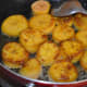 Step four: Flip them now. Cover the pan for a while to speed up cooking process. Continuously, keep the heat low.