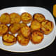 Step five: Turn off the heat. Remove, place the caramelized slices on a serving plate. These slices are mouth-watering. They are mild-sweet, savory, and delicious.