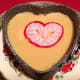 Ready to be served mango dessert, decorated with a marzipan heart.