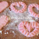 Making hearts out of marzipan. Some edges were decorated by the use of a cake fork.