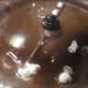 after last kernel pops, add 1/3 cup of unpopped corn