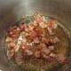 Crisping up the bacon.