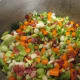 Vegetables added to the bacon.
