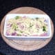 Cheese scattered over ham and sprouts