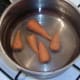 Chantenay carrots added to cold, salted water